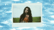 a picture of a woman in a field with the words aespiolife on the bottom right