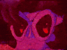 a close up of a cartoon character 's face with glasses and red eyes