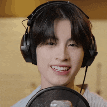 a close up of a person wearing headphones with the letters aa and gif on the bottom