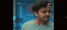 a man with a star plus logo on his head looks sad