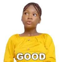 a girl in a yellow shirt has the word good on her shirt