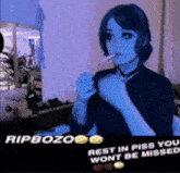 a picture of a woman smoking a cigarette with the words ripbozo rest in piss you wont be missed