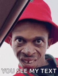 a man wearing a red hat with the words you see my text on the bottom