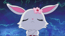 a rabbit with a pink flower on its head