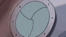 a cartoon drawing of a round window with a hole in the middle of it .