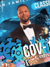 a man in a tuxedo is standing in front of a sign that says cov-t