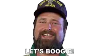 a man with a beard wearing a hat that says uss coral sea on it