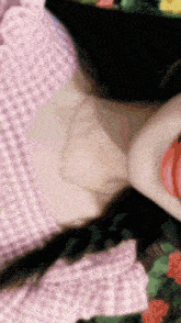 a close up of a woman 's neck with a necklace around her neck