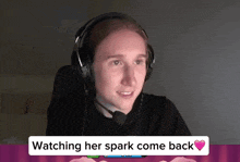 a man wearing headphones with the words watching her spark come back on the bottom