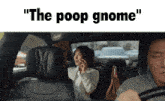 a man driving a car with a woman in the back seat talking on a cell phone