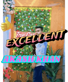 a man giving a thumbs up in front of a wall that says excellent akash khan
