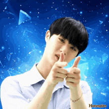 a young man giving a thumbs up with a blue background that says honespir