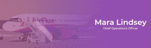 a purple background with a plane and the name mara lindsey on it