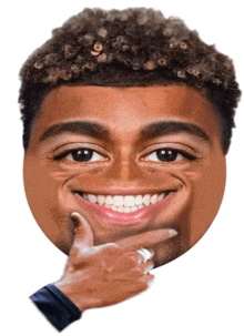a man with a ring on his finger is pointing to his face