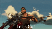 a man is riding a motorcycle with a plane in the background and holding a gun .