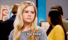 a woman in a gray sweater says you knew .