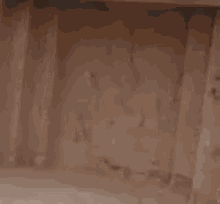 a close up of a hole in a wooden wall .