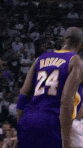 a basketball player wearing a purple jersey with the number 24 on it