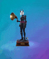 a statue of a woman with horns holding a gramophone and a microphone