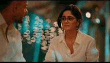 a man and a woman are looking at each other in a blurry photo