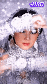a woman in a white dress with the word aisti on the bottom