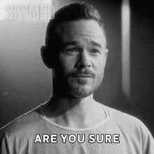 a man in a hospital gown says " are you sure " in a black and white photo