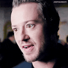 a close up of a man 's face with the words josephquinngifs above him