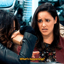 a woman talking to another woman with the words what 's happening written on the bottom