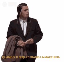 a man in a suit has the words quando ti sequestrano la macchina written below him