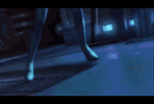 a close up of a woman in a blue suit in a video game .