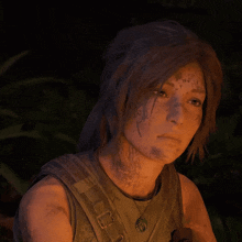 a close up of a woman 's face with a leaf necklace around her neck