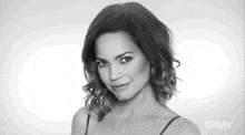 a woman 's face is shown in a black and white photo with the citytv logo in the corner