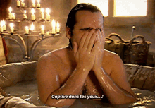 a shirtless man in a bathtub with captive dans tes yeux written below him