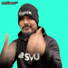 a man wearing a beanie and a hoodie that says svu on it