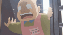 a man with a pink apron that says kamota on it