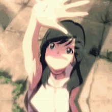 a girl is covering her face with her hand