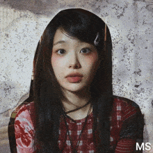 a picture of a woman with the word ms on the bottom right