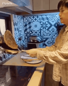 a person is cooking in a kitchen and the word piyada is on the bottom