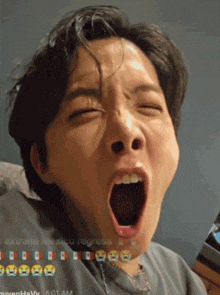 a close up of a person yawning with the time 6:01 am on the bottom