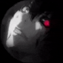 a black and white drawing of a person with a red light behind them .