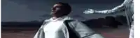 a man in a white jacket is being held by another man in a white suit .