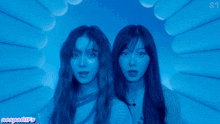 two girls are standing in a tunnel with a watermark that says megangifs