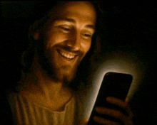 a painting of jesus smiling while looking at his phone