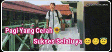 a man is walking down a sidewalk with the words pagi yang cerah sukses selaluya on the bottom