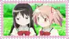 two anime girls are standing next to each other on a green field .