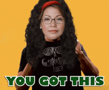 a woman wearing glasses and a black shirt that says " who wants a custom ride "