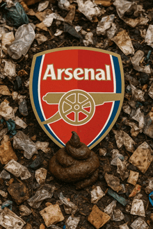 a pile of poop next to a sign that says arsenal on it