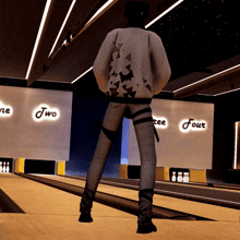a person standing on a bowling alley with a sign that says two and four