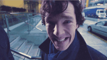 a close up of a man 's face with a smile on his face