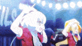a couple of anime girls are dancing on a stage